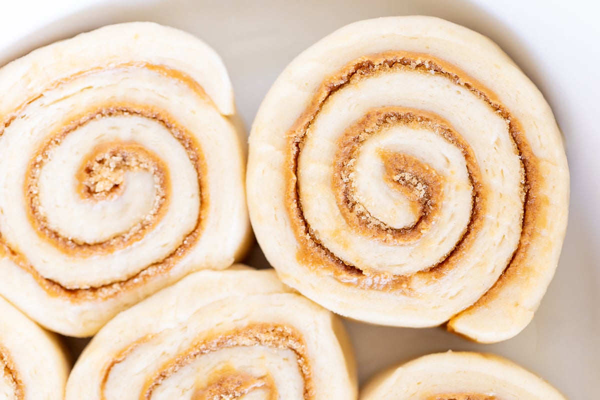 Cookie Butter Cinnamon Rolls on a white plate.