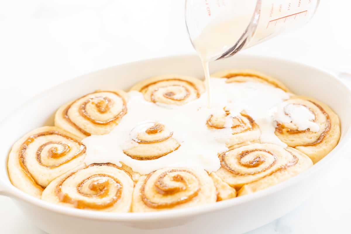 A white dish with cookie butter cinnamon rolls.