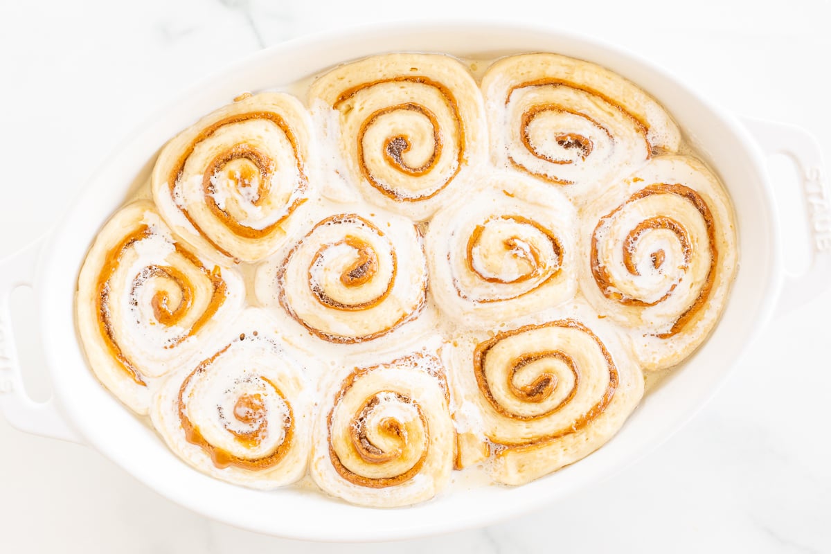 Cookie Butter Cinnamon Rolls in a white baking dish.