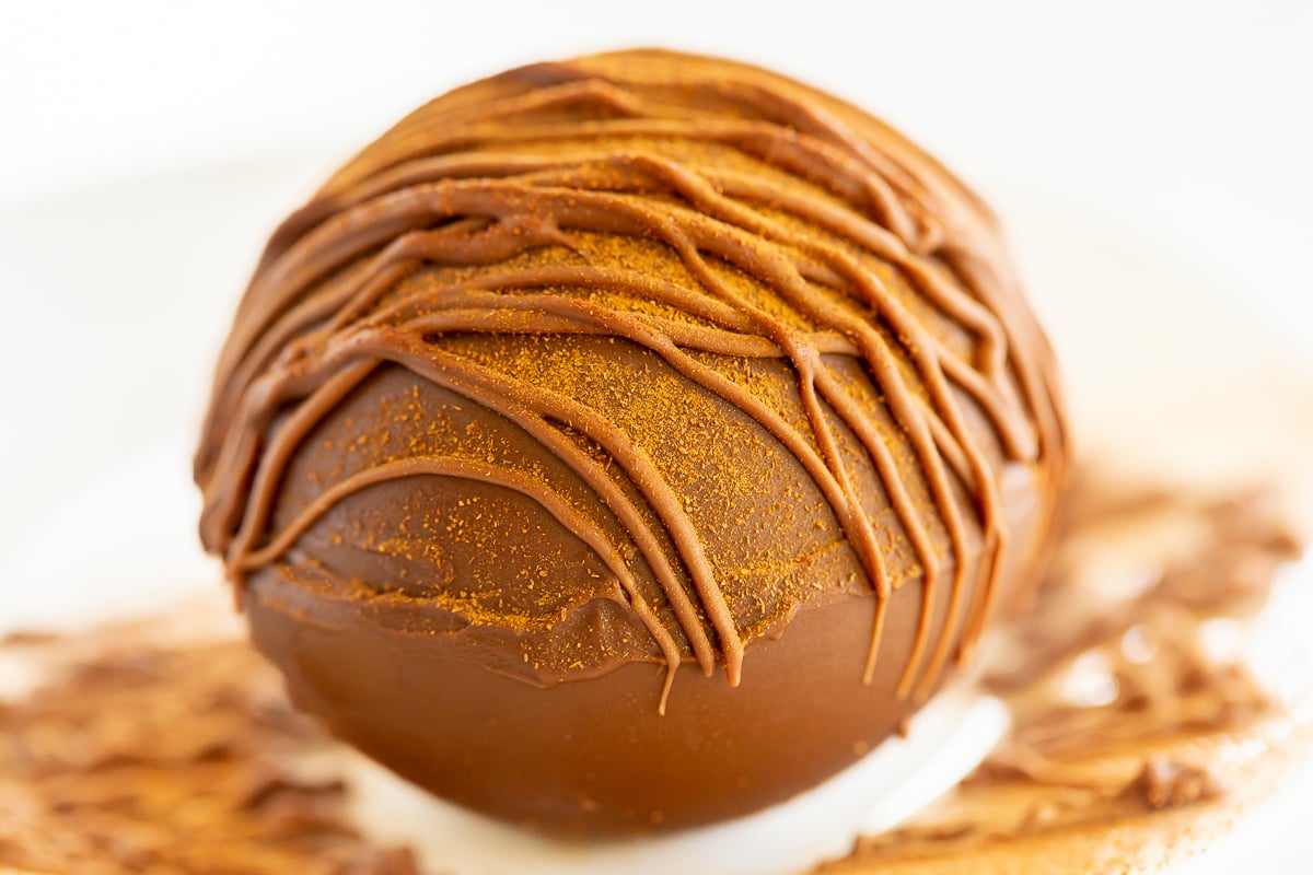 A Mexican hot chocolate bomb on a white surface