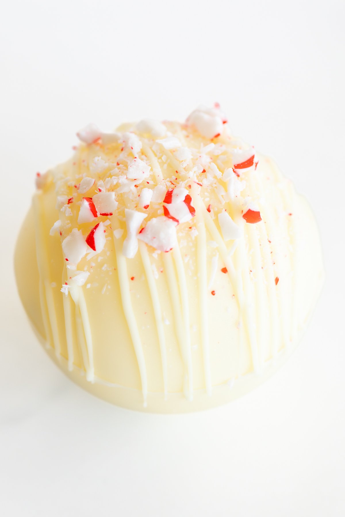 A white ice cream ball with peppermint sprinkles on top, perfect for hot chocolate bombs.