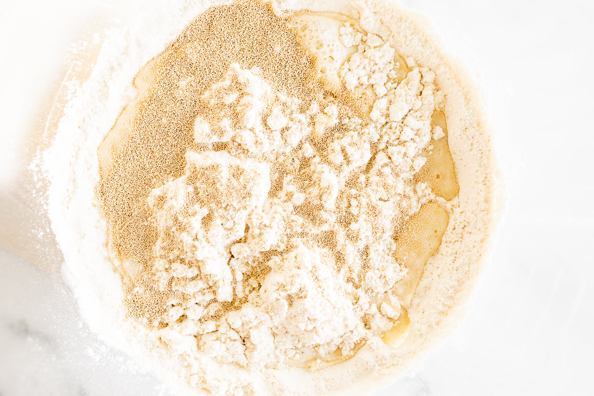 A bowl with cookie butter and flour in it.