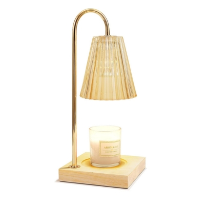 A lamp with a candle on top of it.