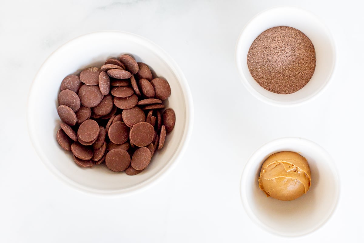 Peanut butter hot chocolate bombs in bowls.