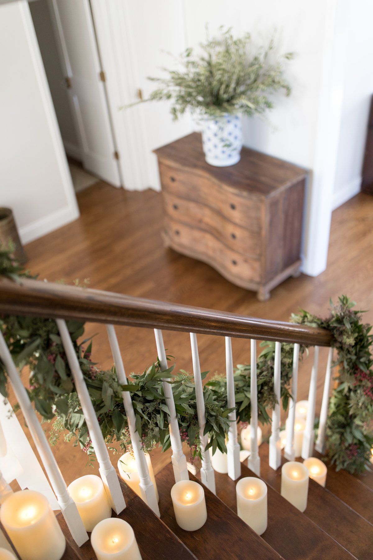 A staircase with flameless battery operated candles on it.