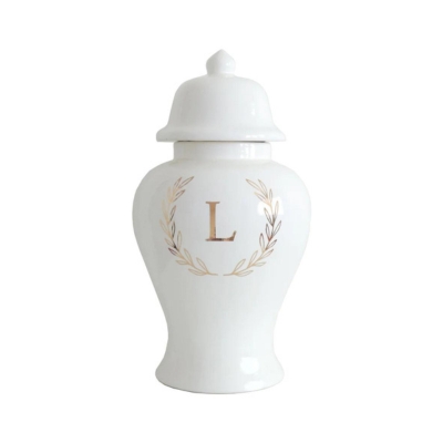 A white urn with the letter l on it.