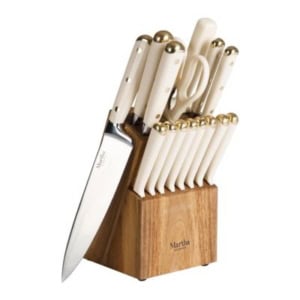 A wooden knife block set with cream-colored handles and gold accents, perfect for enhancing your kitchen counter organization, containing multiple knives and kitchen scissors.