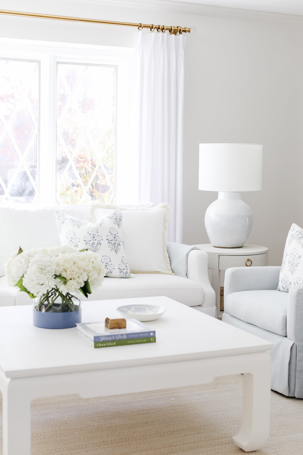 A white and blue Serena and Lily Sofa is the centerpiece of this living room.