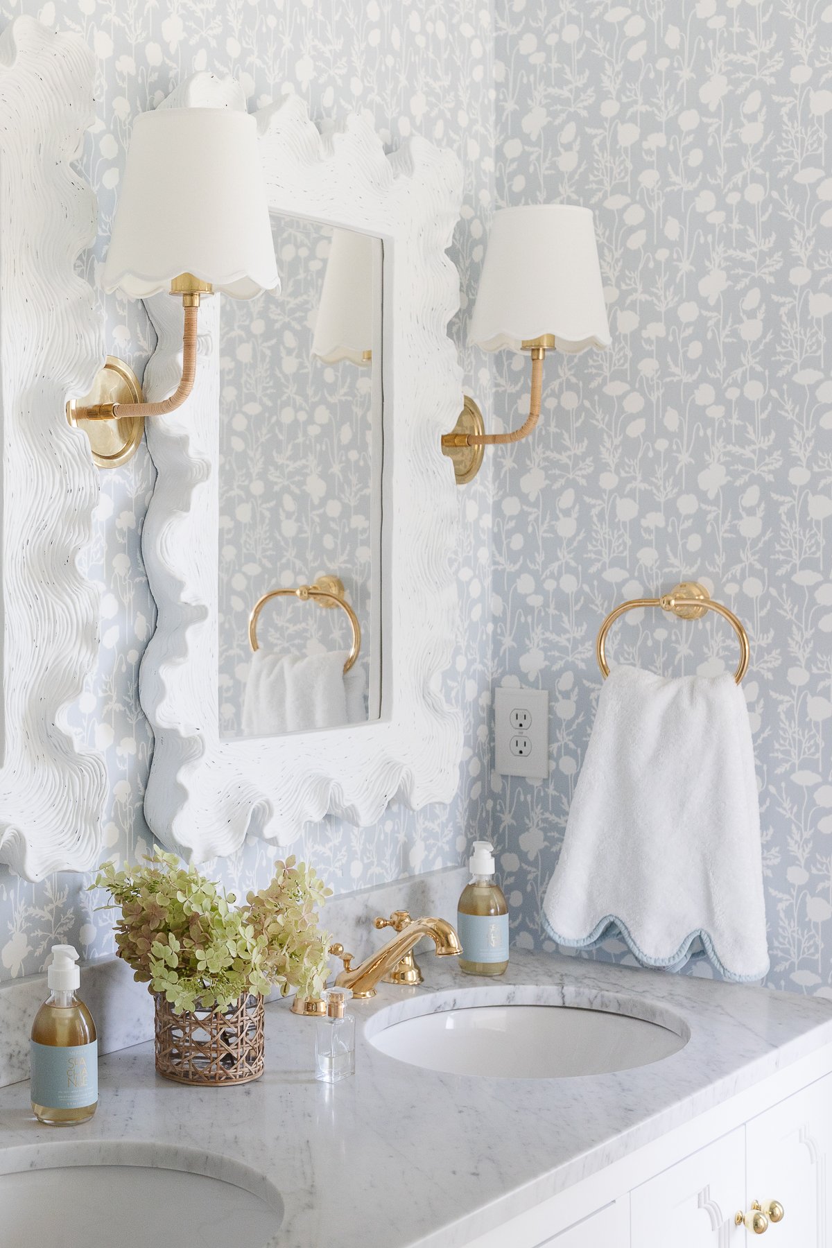A bathroom with two sinks and two mirrors.