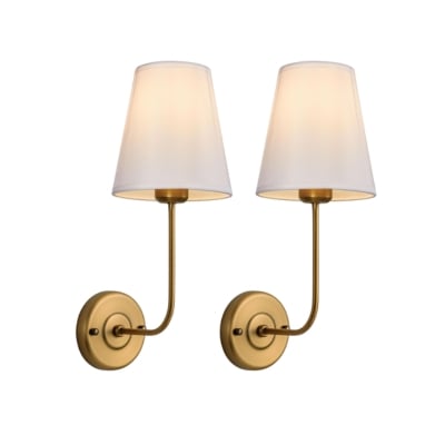 A pair of gold bathroom sconces with white shades.