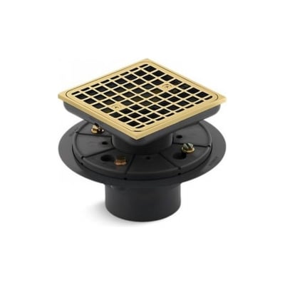 A square brass drain with a black and gold finish.