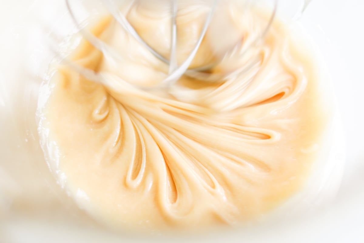 Whipped honey being processed in a stand mixer.