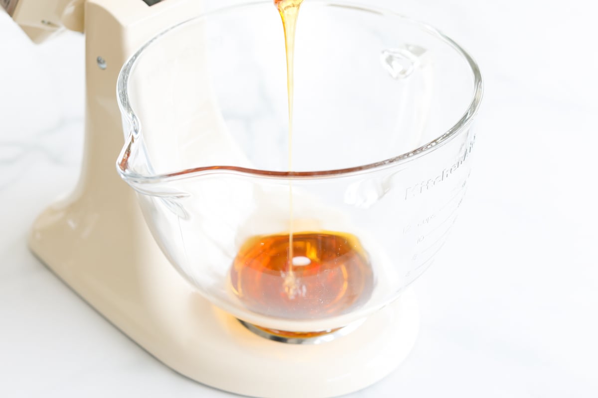 Whipped honey being processed in a stand mixer.