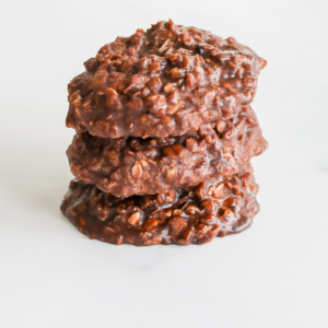 A stack of preacher cookies on a white surface.