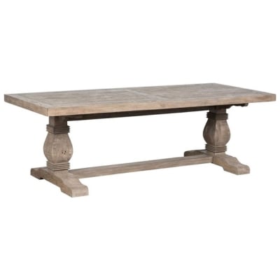 A wooden dining table with a RH Look for Less design and a wooden base.