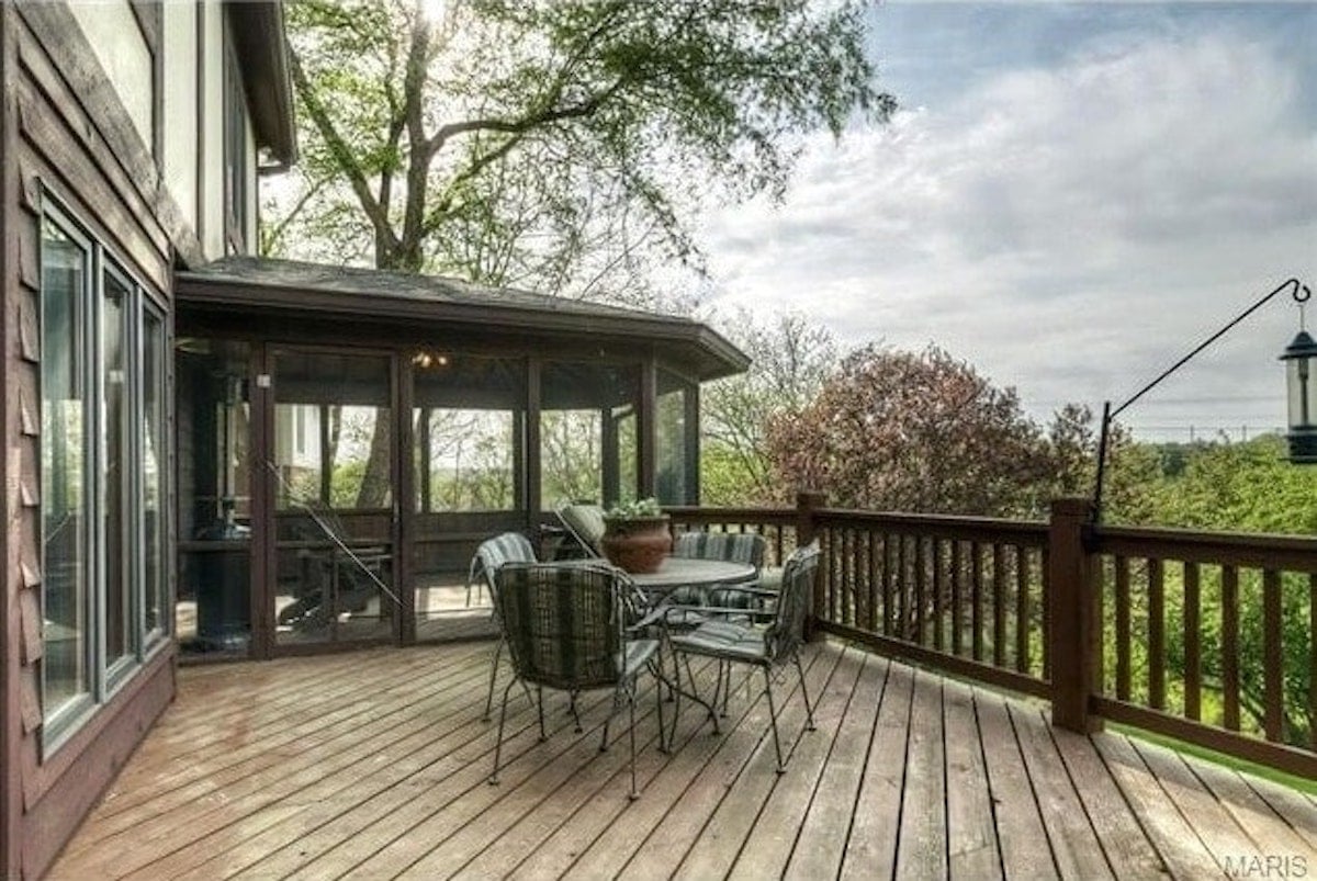 An outdoor living space with a table and chairs.