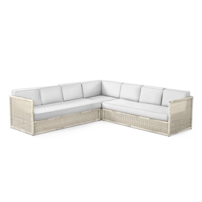 A white wicker sofa on a white background.