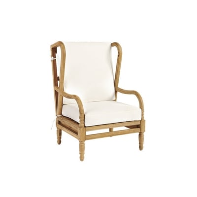 A white cushioned wicker wing chair, perfect for patio furniture.