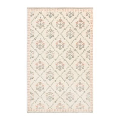 A white and pink rug with a floral design.