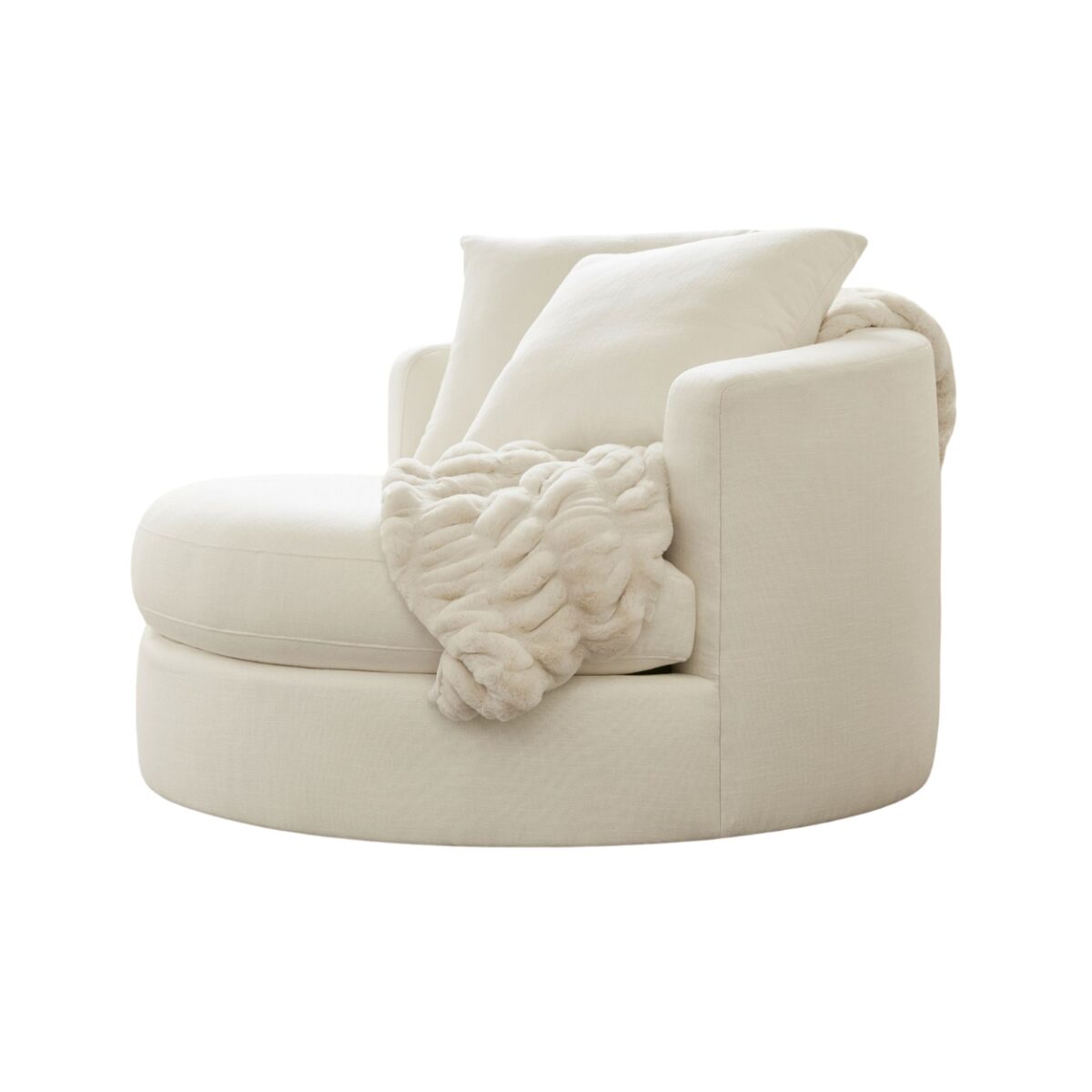 A round, cream-colored armchair with a large cushion and a thick, knitted blanket draped over the side offers the perfect pottery barn look for less.