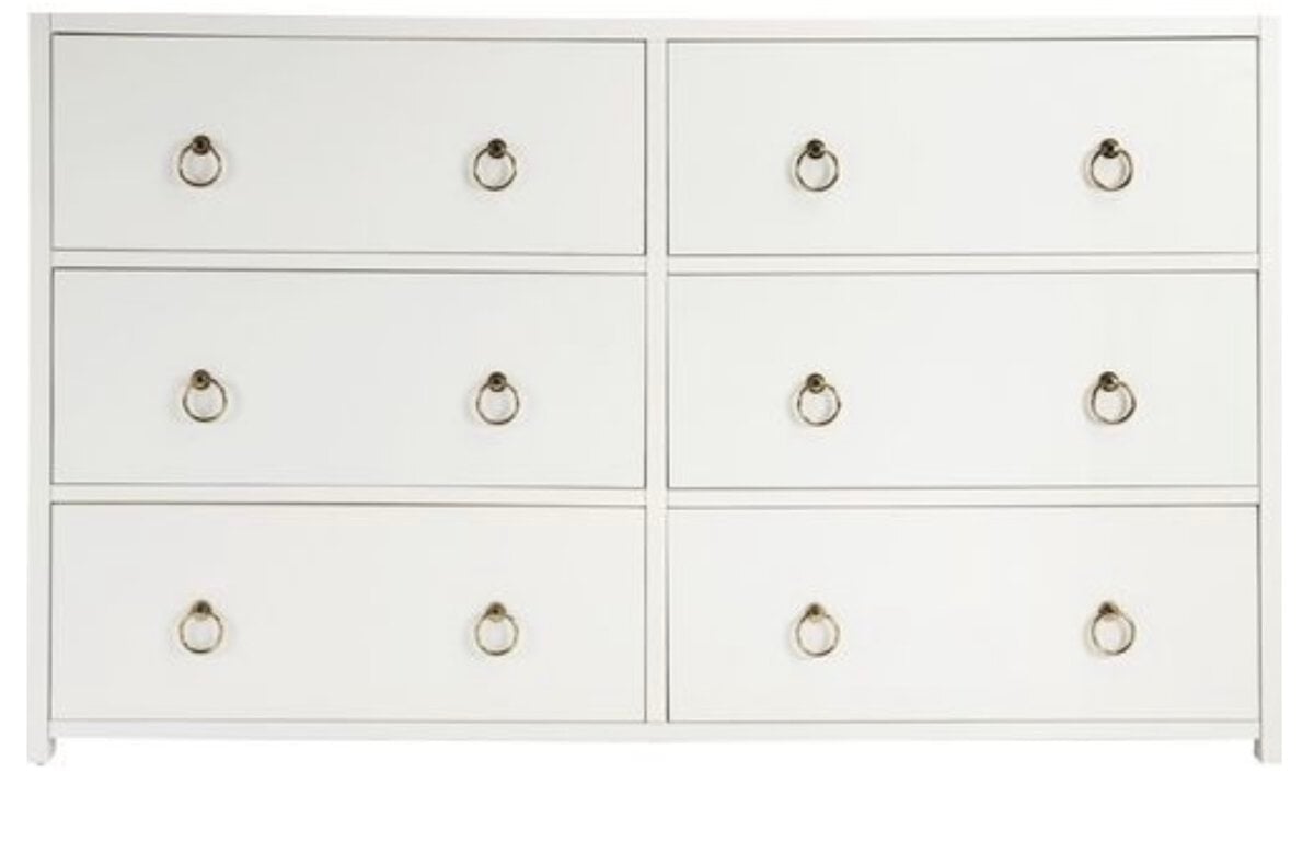 This white six-drawer dresser, featuring elegant metal pull handles and arranged in two rows of three, offers a Serena and Lily look for less, bringing both style and functionality to your space.