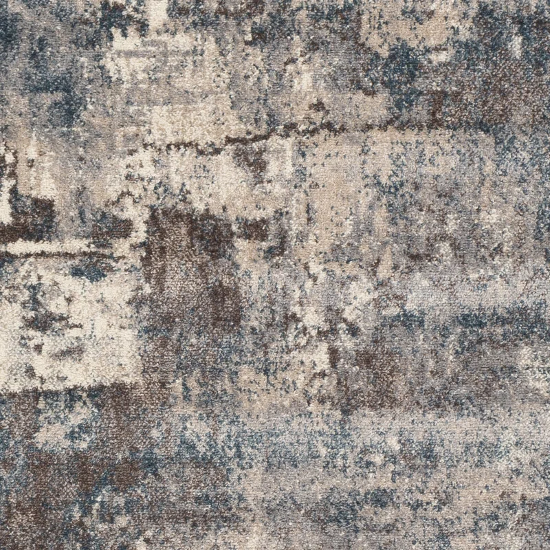 Abstract textured pattern in shades of beige, gray, and blue with a woven appearance resembling a layered, distressed surface. Use this design to find inspiration in our rug size guide for the perfect fit in your space.