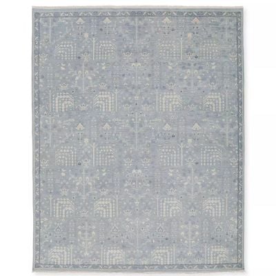 A rectangular rug in a light gray and white intricate geometric pattern is the perfect addition to any space. Use your rug size guide to find the ideal fit for your room, ensuring both style and functionality meet harmoniously.