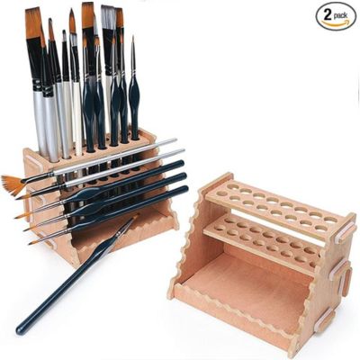 An organized setup for crafting, this wooden brush holder showcases various paintbrushes, while a second identical empty holder stands ready to accommodate more tools.