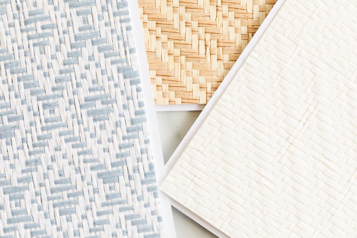 Three textured materials resembling Serena and Lily wallpaper: one with blue and white woven patterns, another with tan threads, and a third featuring a subtle white embossed design.