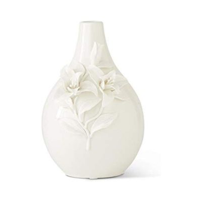 White ceramic vase with a round base and narrow neck, adorned with raised floral designs, offering a LoveShackFancy look for less.