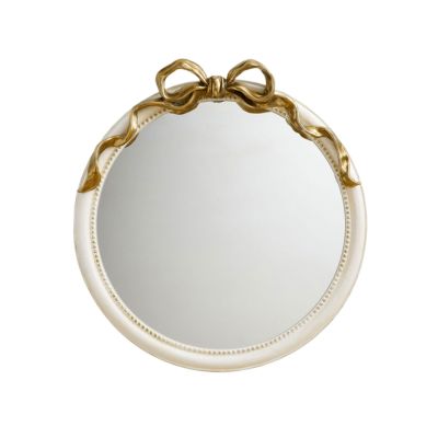 This round mirror captures the LoveShackFancy look for less, featuring a white frame and an elegant gold ribbon accent on top.